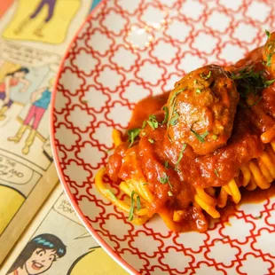 a plate of spaghetti with meatballs