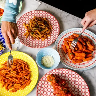 a plate of pasta and a bowl of pasta