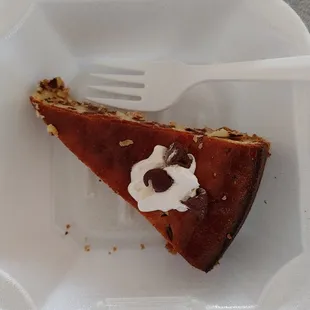 a slice of pie in a styrofoam container