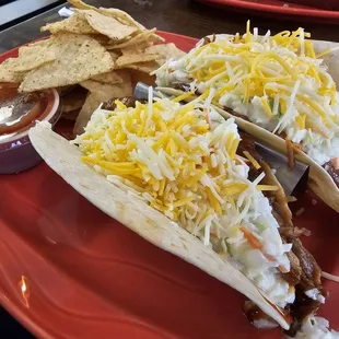 The Taco Tuesday BBQ Pork tacos, topped with coleslaw and a generous helping of shredded cheese. Delicious!
