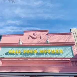 Sneak peek of our new facade -- pretty in pink &amp; teal!