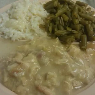 Chicken pie, green beans and rice with gravy.