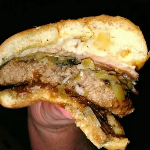 Half of &quot;The Dog&apos;s Bollocks&quot; burger, despite well done cook, juicy and full of flavor, 5/5