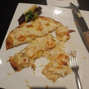 My yummy seafood flatbread with shrimp, lump crab meat, scallops in a creamy garlic sauce.