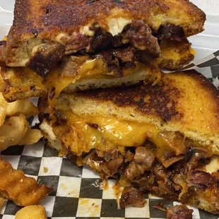 Thursday special! Burnt end grilled cheese! Brisket is tender and tasty, there's 2 types of cheese with a crunchy crusty bread.