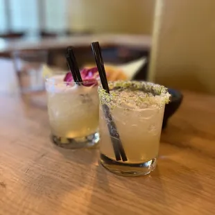 two cocktails on a table