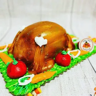 a turkey on a plate with carrots