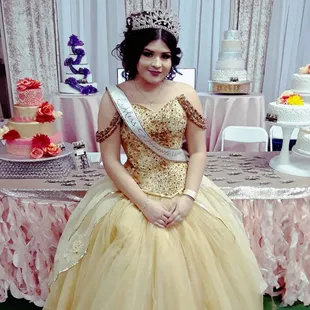 a woman in a gown and tiable