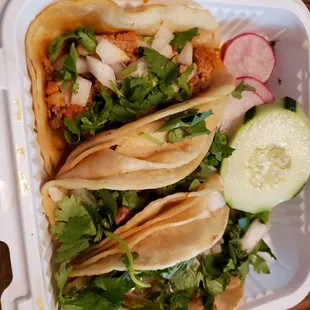 Created a trio of tacos: tripe, prok rinds, and chicken