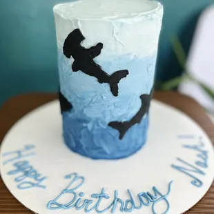 a blue and white birthday cake