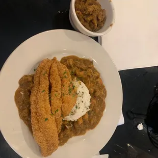 Fried fish with rice &amp; etouffee side of cornbread dressing