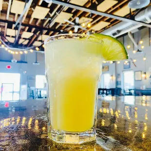 a margarita with a lime slice on the rim