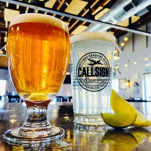 a glass of beer and a half of a lemon