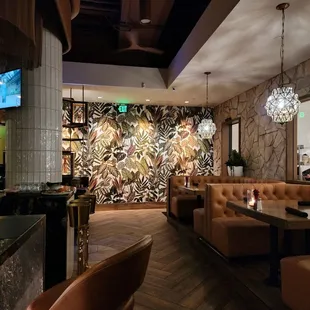 Hallway to Bathroom Full Bar on left and Booth on right