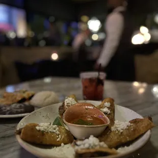 Birria tacos appetizer and berry margarita