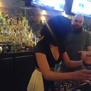 a man and a woman at a bar