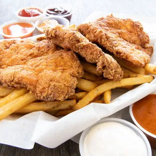 a basket of fried chicken and french fries