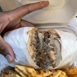 Deliciousness!! Chopped Cheese Roll.  The Fries are Crispy, Fresh, and Tasty
