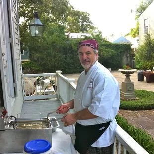 Chef John frying shrimp at the Bianchi House