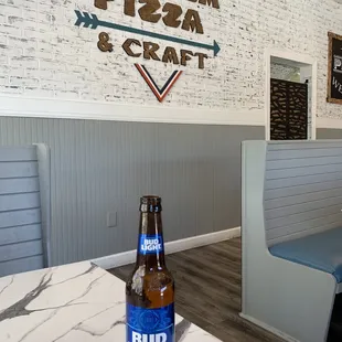 a bottle of beer on a table
