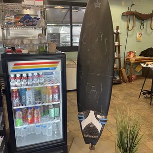 a surfboard and a cooler