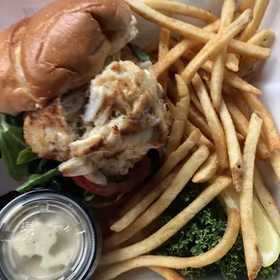 Broiled Crab cake sandwich with old bay fries