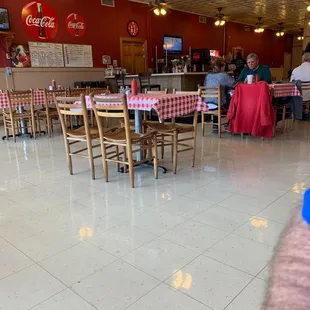 a restaurant with tables and chairs