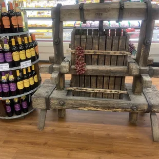 a wooden chair with wine bottles on it