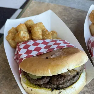 Double hamburger, mustard, pickle, grilled onions. Tots.