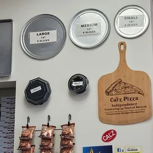 a variety of meats hanging on a wall