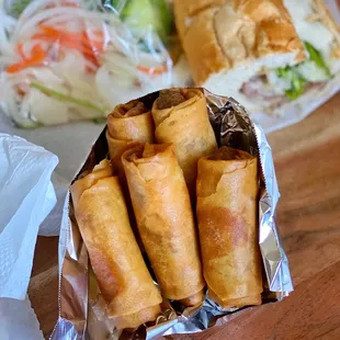 a variety of food wrapped in foil