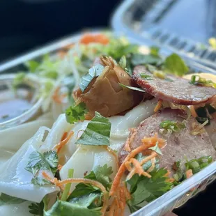  close up of a salad in a plastic container