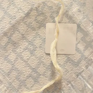 a piece of fabric with a tag on it