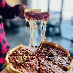 a slice of deep dish pizza