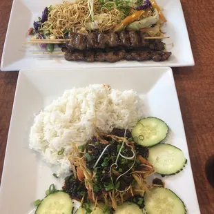 Steak skewers with Pad Thai and fresh vegetables.  Deep fried salmon nuggets w/ ginger sauce and jasmine rice.