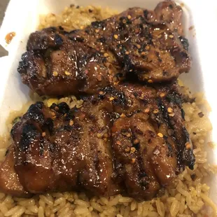 chicken and rice in a styrofoam container
