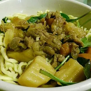 Beef stew shown with chow mein
