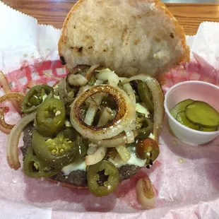The bison burger with jalapeños and onions.
