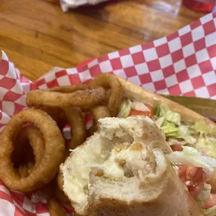 Chicken cutlet sandwich with onion rings