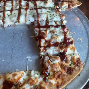 a half eaten pizza on a plate