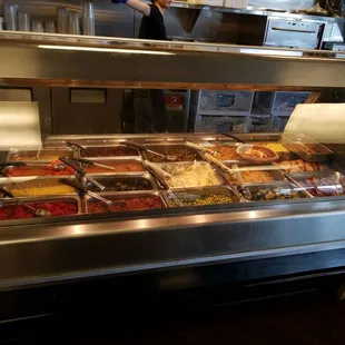a buffet with a variety of food items