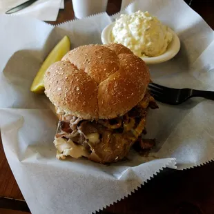 Ole Smokey with potato salad and a pickle.