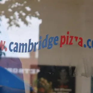 reflection of umbrella in window