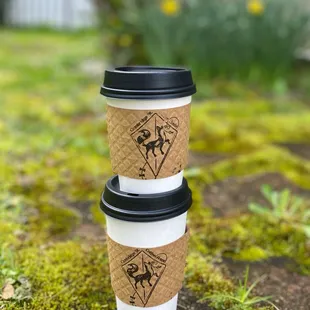 two coffee cups on the ground