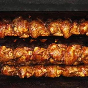 chicken skewers being cooked