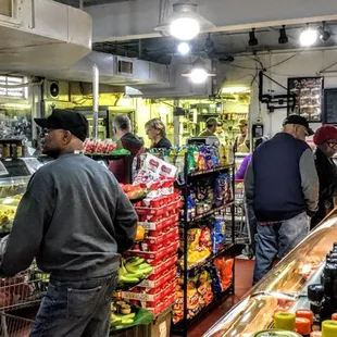 people shopping in a grocery store