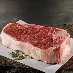 a piece of beef on a piece of parchment