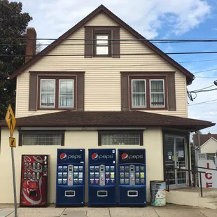 two vending machines in front of a building