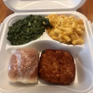 Crab cake platter with greens and macaroni and cheese