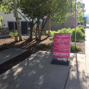You can park in the back and enter through our beautiful peaceful patio area.  Sit and listen to the birds chirp.